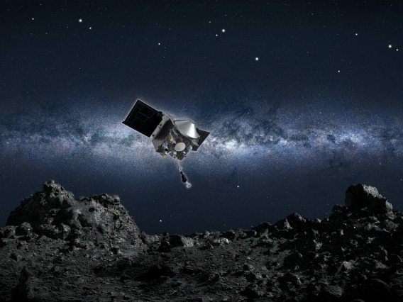 Artist&#039;s conception of NASA’s OSIRIS-REx spacecraft collecting a sample from the asteroid Bennu.
