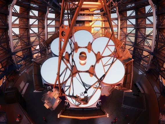 Rendering of the Giant Magellan Telescope's primary mirror, consisting of seven mirror segments arranged like petals of a flower. 