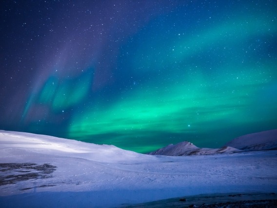 Aurora over an icy landscape