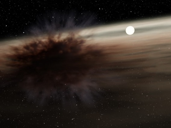 The collision of two large, asteroid-like bodies orbiting a star created a star-size dark cloud that blocks that star light detected by NASA&#039;s Spitzer Space Telescope and ground-based telescopes.